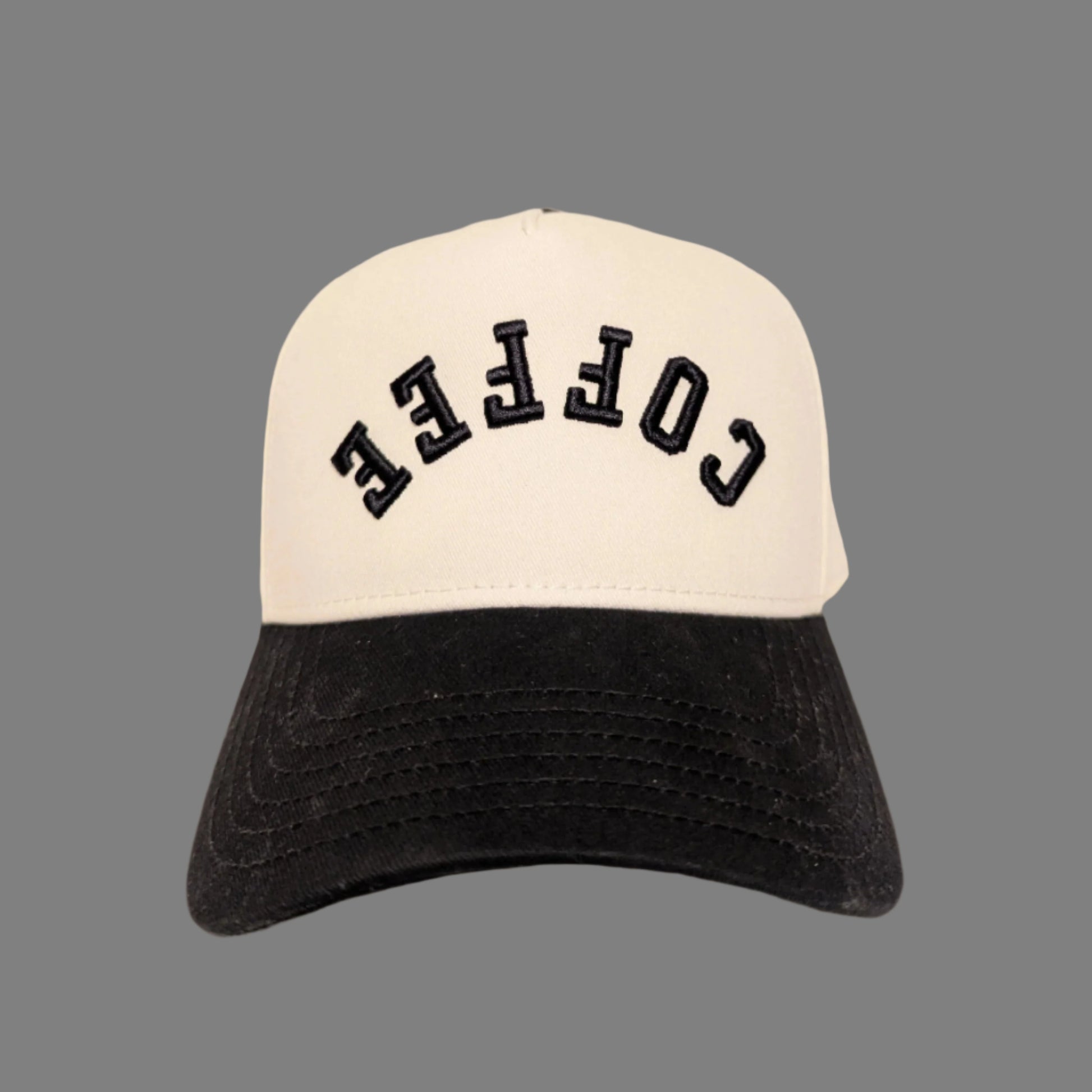 Two-tone cap with 'COFFEE' text on a beige background